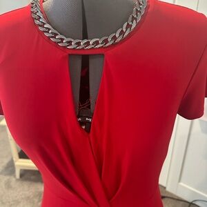 Women’s red dress with chain at neck